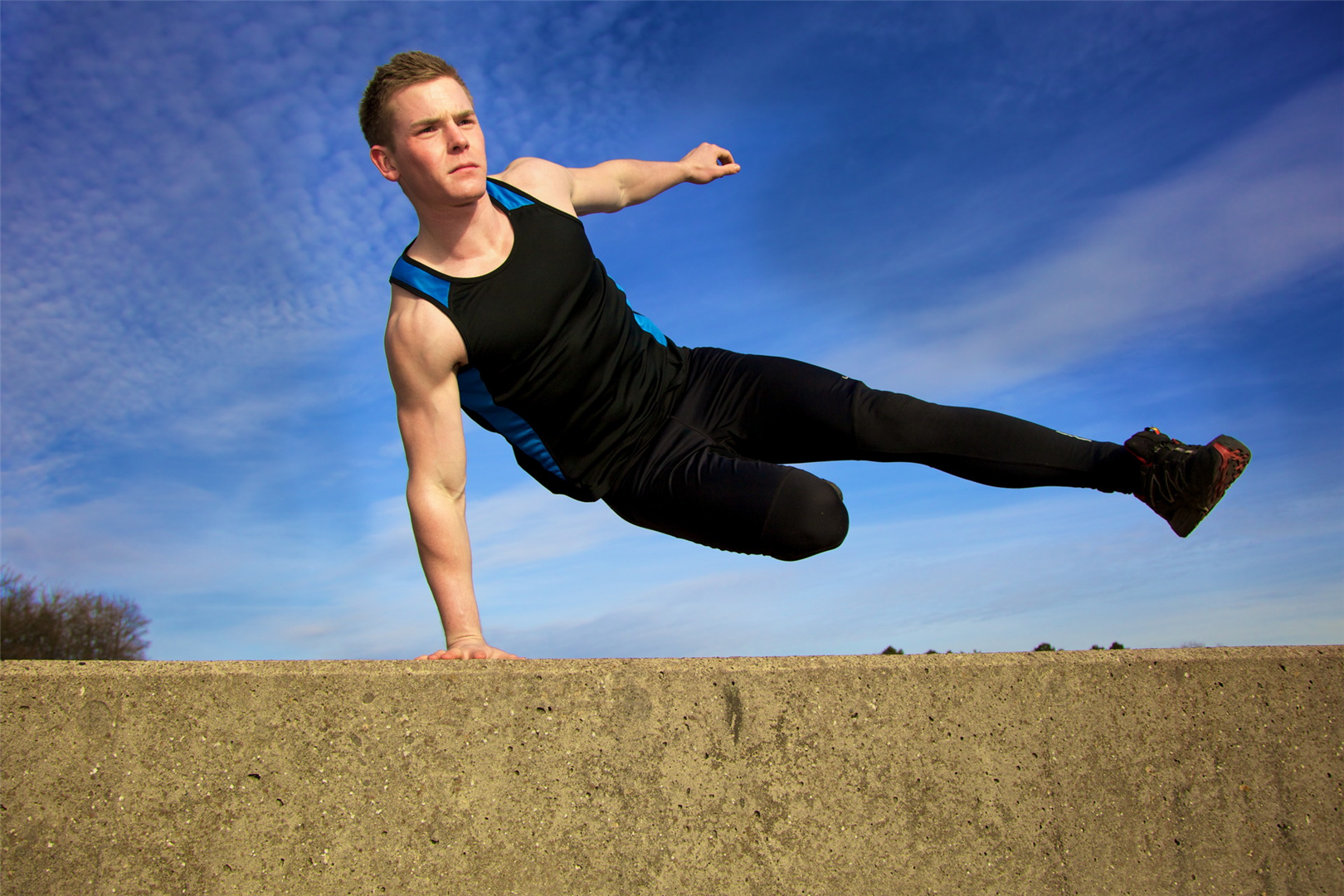 Free running parkour atlhelte in the beach of barcelona header